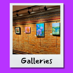 Photo of artwork with floral themes on a brick wall in the Augusta and CO gallery