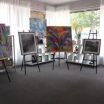 photo of paintings on easels
