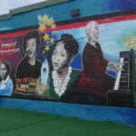 Photo of Golden Blocks mural by Salonika Rhyne. The "Women of Empowerment" mural features Ursula E. Collins, Rosa C. Tutt, Marjorie B. Carter, Margaret L. Laney, Rosa T. Beard, and Ruth B. Crawford