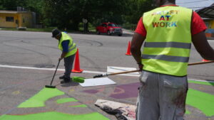 Photo of crosswalk being painted
