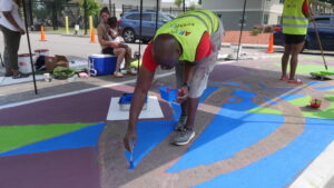 Photo of Ray Sturkey painting crosswalk