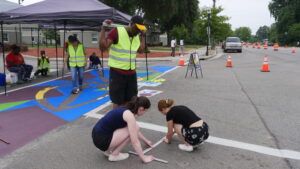 Photo of student gridding crosswalk for painting