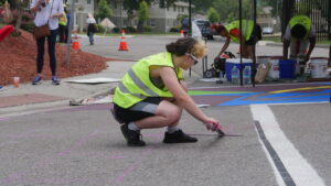 Photo of Galadra Plummer gridding crosswalk for painting
