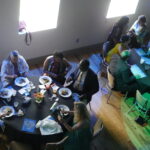 Photo of guests at a dining table.