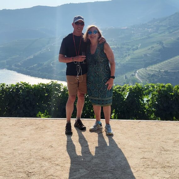 Ed and Brenda Durant standing in front of a mountain range.