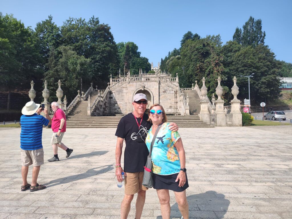 Brenda and Ed Durant standing in front of a gothic style cathedral