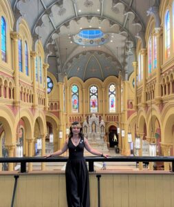 Galadra posing in front of the Sacred Heart Great Hall