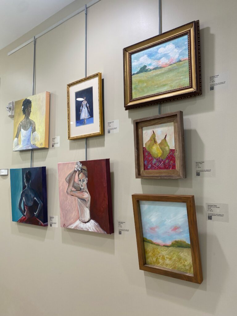 Paintings hanging in a gallery