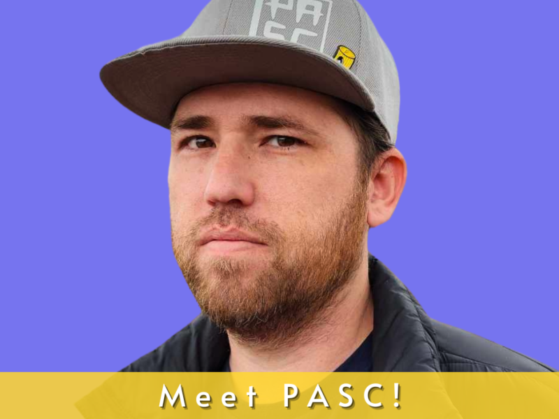 photo of jon pascal. He is a Caucasian male with brown hair and brown eyes. He is wearing a gray baseball cap and black jacket.