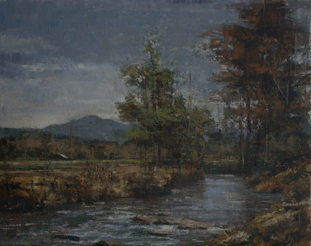 Painting of a river at dusk with large trees in the foreground and a mountain in the background. It's a fall scene.