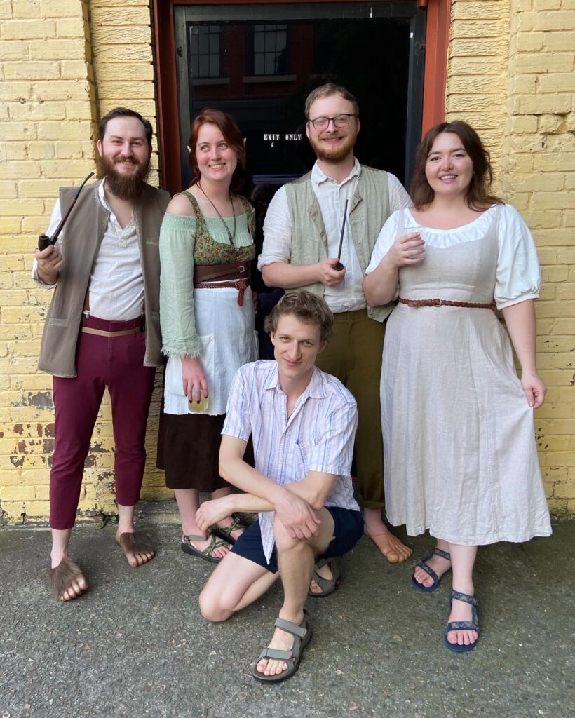 A group of two Caucasian women and 3 Caucasian men dressed as Hobbits