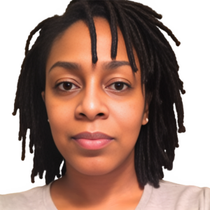 Picture of an African American woman with shoulder length dreads. She is waring a white top.
